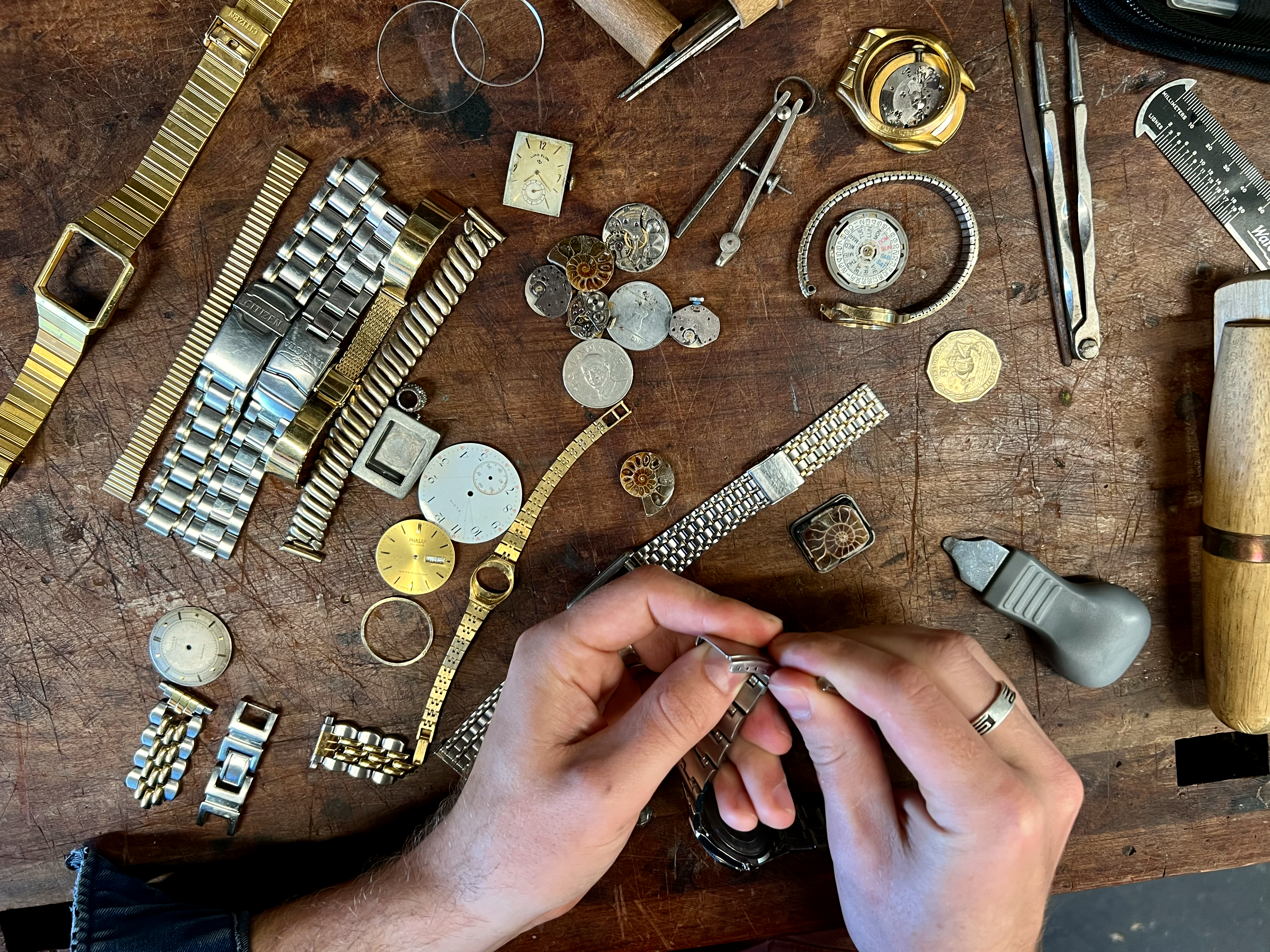 Watch parts laid out on the workbench